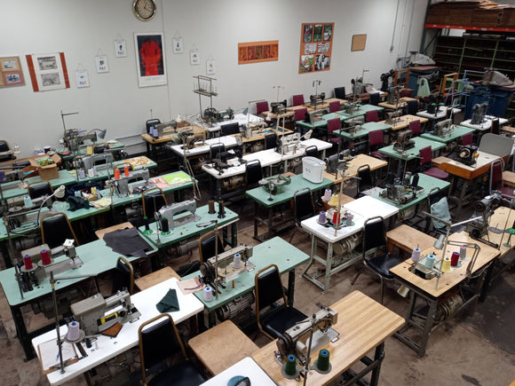 Production floor for marine and outdoor upholstery, fully equipped facility, sewing machines, cutting tables, marine vinyl, outdoor fabrics, Sunrella boat gear totes, gear duffels, toss pillows. 61 Oakwood, Lake Zurich, IL.